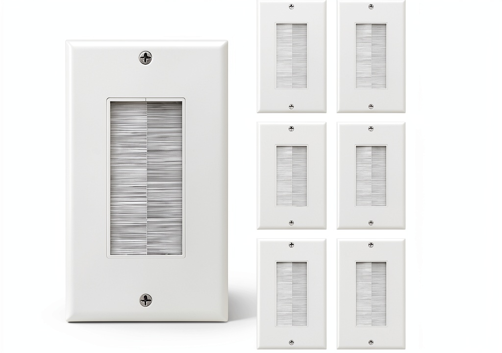 In-wall cable management plates with cables hidden inside